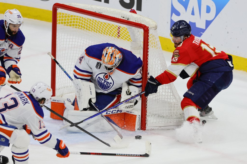 Stuart Skinner makes one of his 30 saves on Matthew Tkachuk's wraparound shot during the Oilers' Game 5 win.