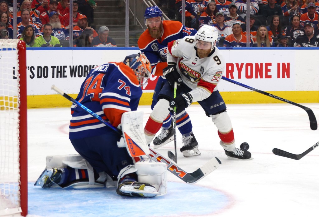 Stuart Skinner makes one of his 32 saves in the Oilers' Game 4 blowout victory.