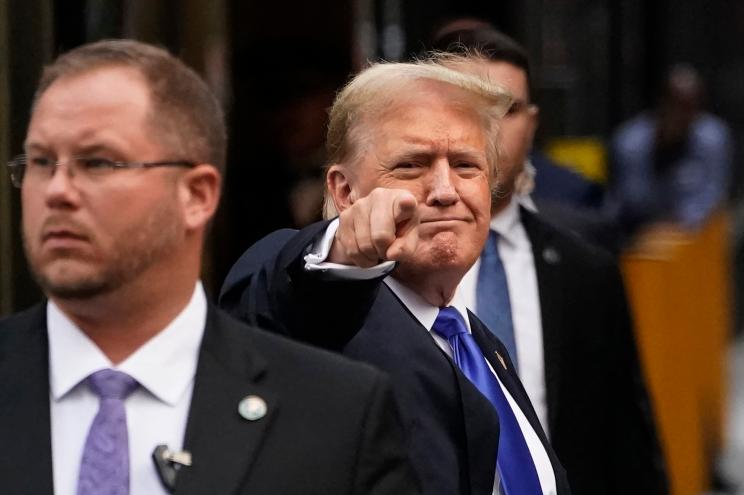 Former US President and Republican presidential candidate Donald Trump points as he arrives back at Trump Tower after being convicted in his criminal trial in New York City, on May 30, 2024.