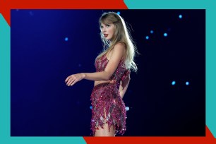 Taylor Swift poses onstage.