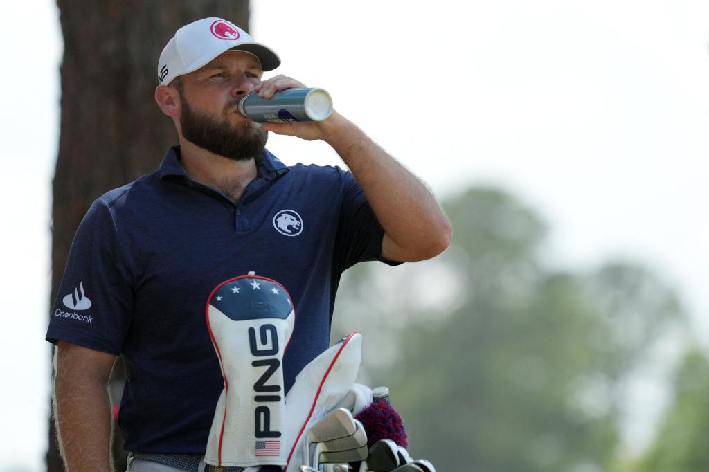 Tyrrell Hatton, who stands at 1-under par, takes a drink before teeing off on the second hole during the third round of the U.S. Open.