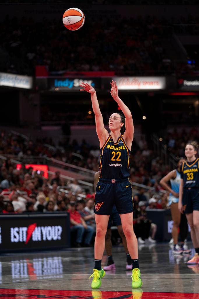 Indiana Fever guard Caitlin Clark shooting a free throw during a basketball game at Gainbridge Fieldhouse