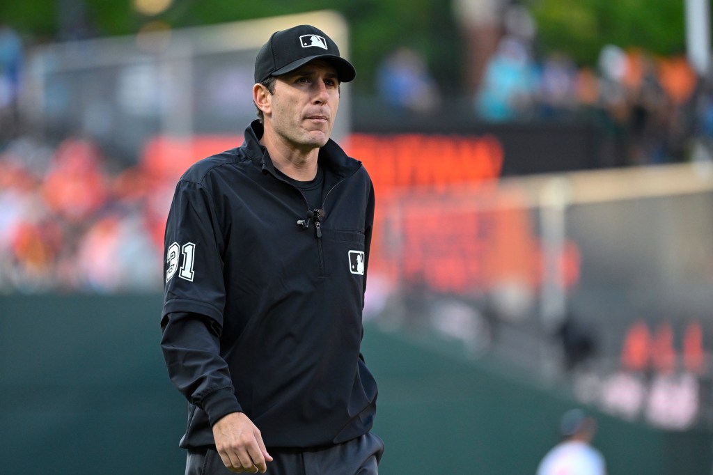 Umpire Pat Hoberg looks on during a baseball game between the Baltimore Orioles and the Los Angeles Angels, May 17, 2023, in Baltimore. 