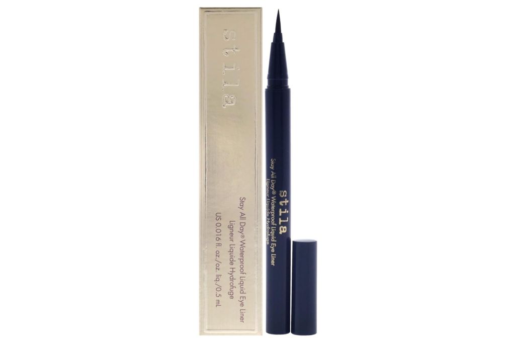 A stila eyeliner in black with its package behind it.