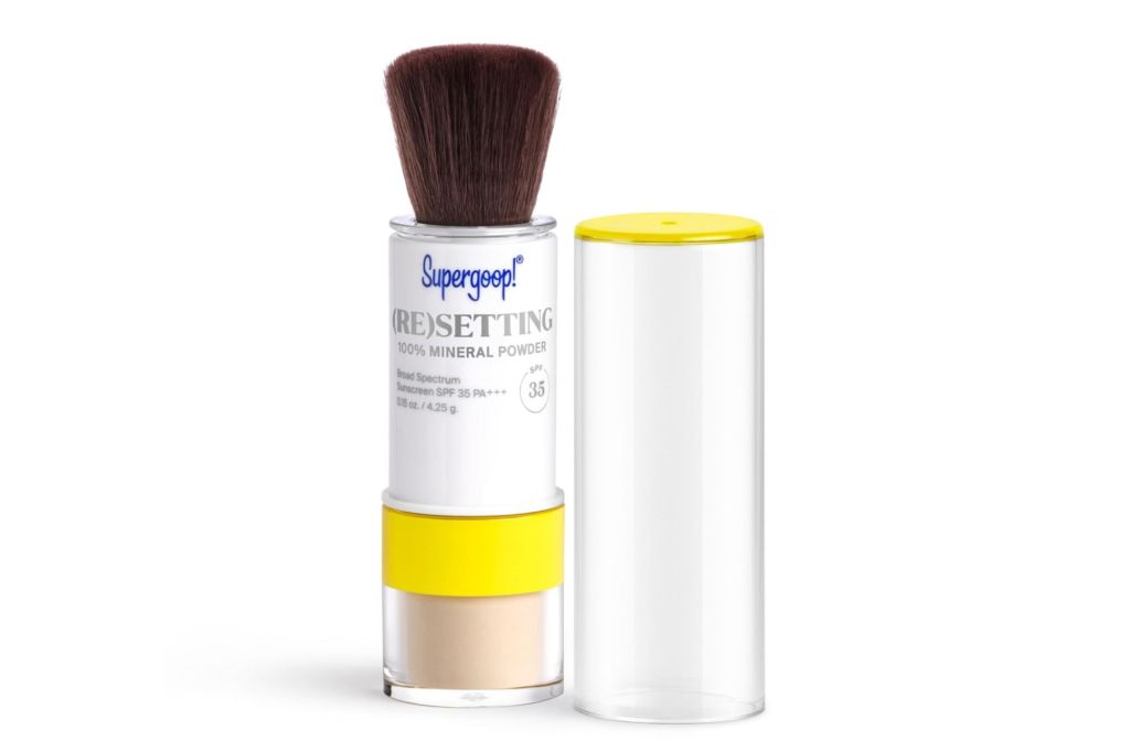 A mineral sunscreen for hair in a brush applicator.