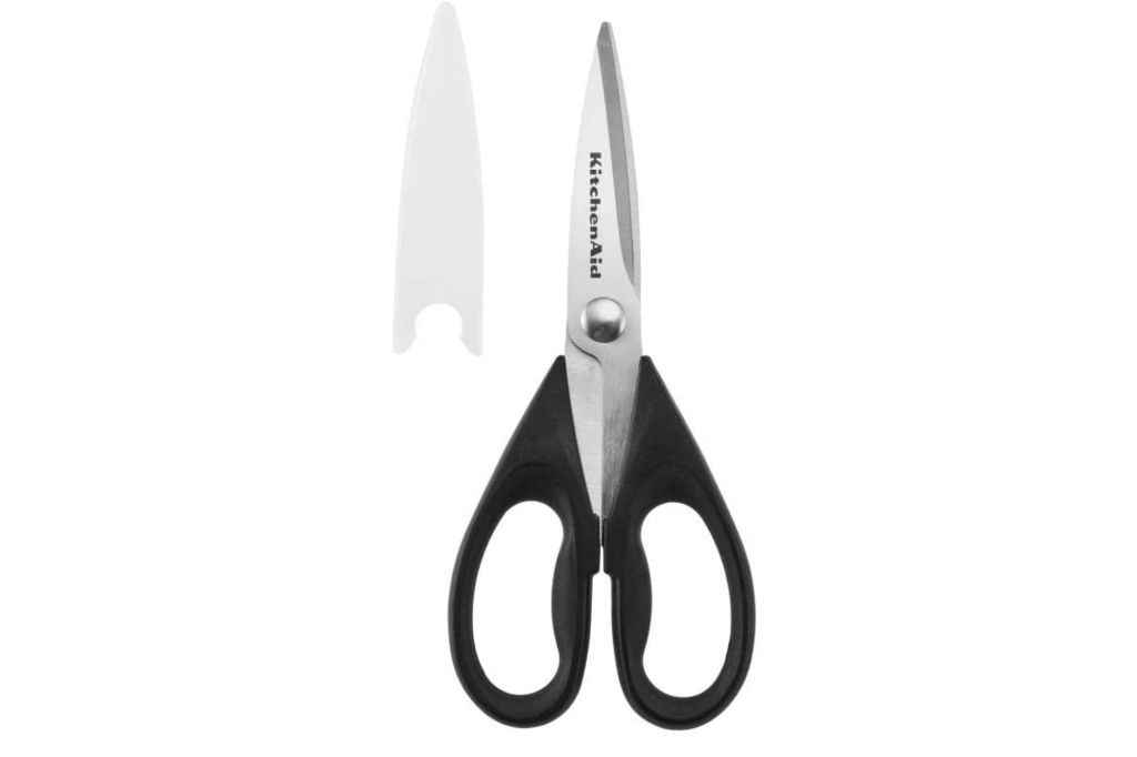 A pair of kitchen shears and a cover.