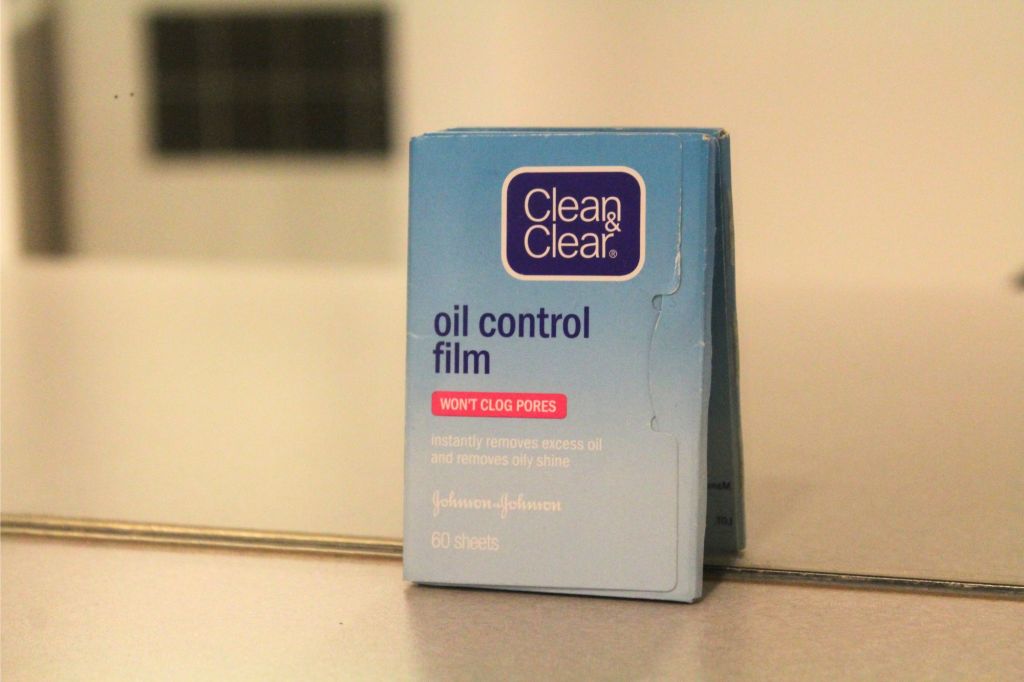 A packet of oil control wipes on a counter.