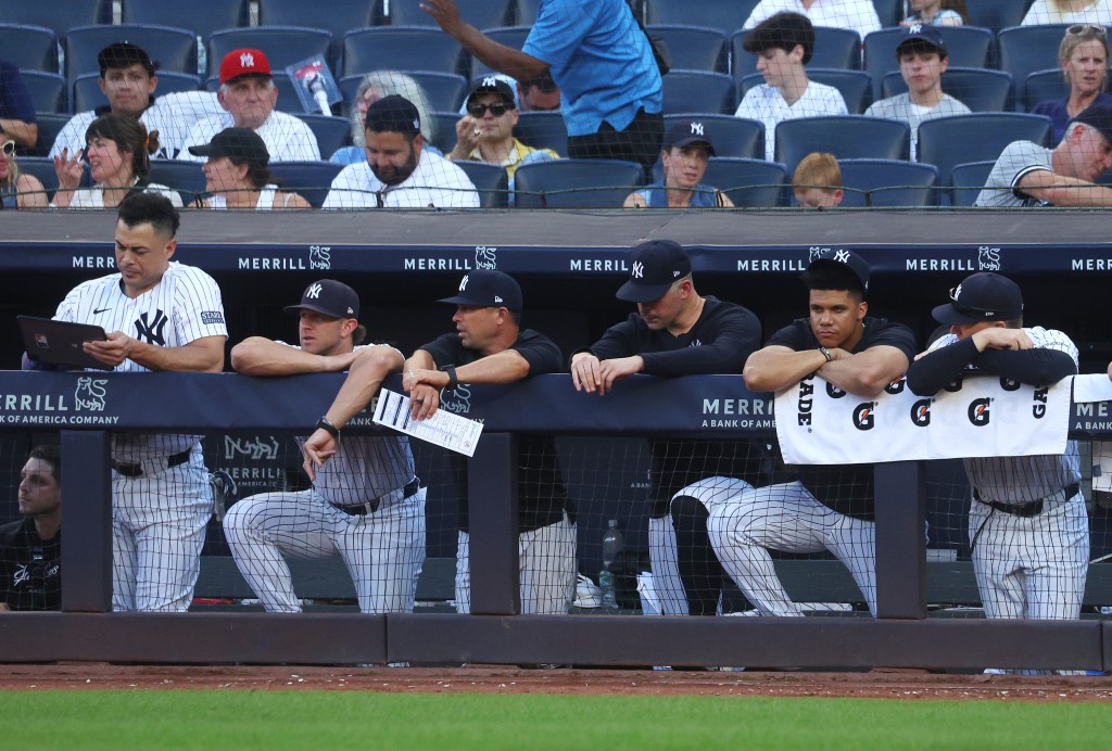 A dejected Yankees bench looks on during the ninth inning of the Bombers' 17-5 blowout loss to the Orioles.