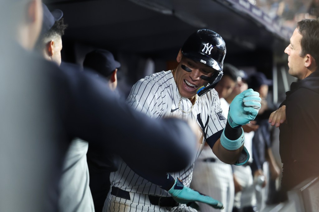 Aaron Judge #99 of the New York Yankees reacts after a solo home run against the Los Angeles Dodgers