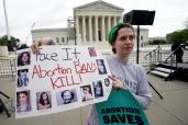 Abortion rights supporter and anti-abortion activists square off in front of the Supreme Court.