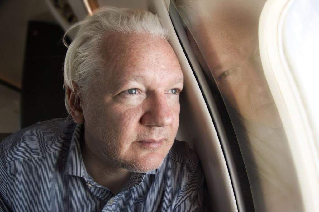 Assange onboard the VistaJet plane as he travelled from London to Saipan on Monday to appear for a plea deal