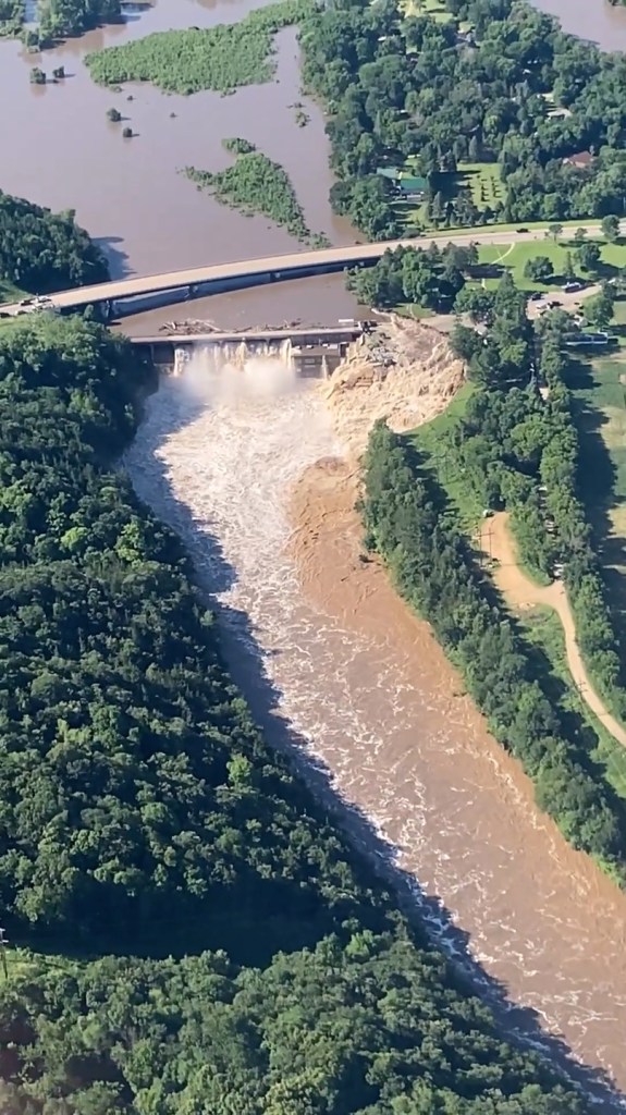 Officials said the dam burst after being hit by flood waters and debris over the weekend.