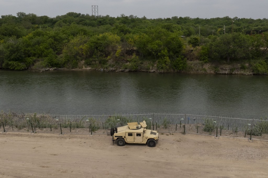 An aerial view of a military vehicle at Shelby Park, where Texas has established border enforcement operations in Eagle Pass