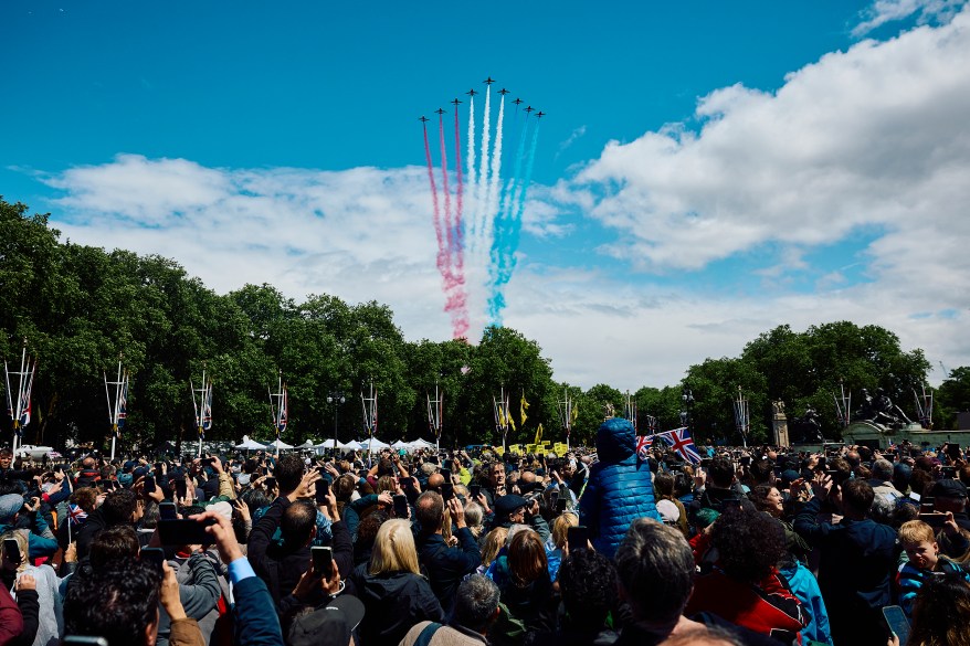 British Royal Air Force's (RAF) aerobatic team, the "Red Arrows" perform a flypast over Buckingham Palace.