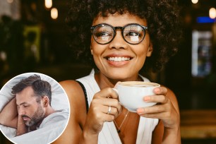 African woman with a cup of coffee at cafe. Female having coffee and looking away.