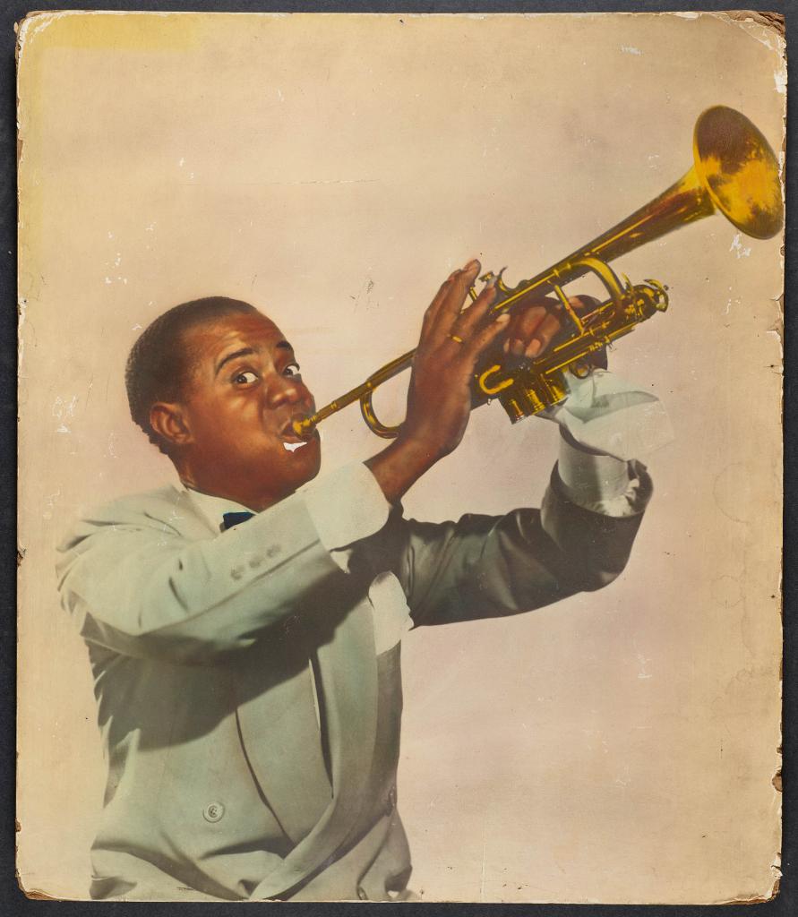 Louis Armstrong in vintage hand-tinted photo from the Apollo.