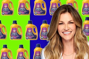 Erin Andrews smiling in front of a variety of Arm & Hammer laundry detergents.