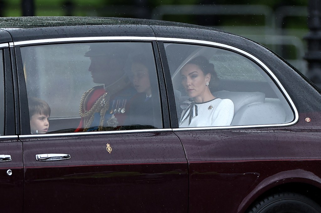 Britain's Catherine, Princess of Wales, (R) arrives with Britain's Prince William, Prince of Wales, (rear C) and their children Britain's Prince George of Wales (C) and Britain's Prince Louis of Wales (L) to Buckingham Palace before the King's Birthday Parade "Trooping the Colour" in London on June 15, 2024.