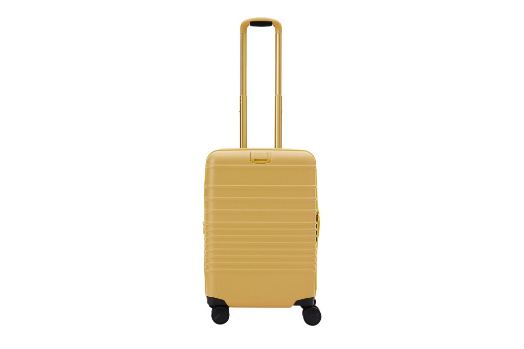 A yellow suitcase with wheels