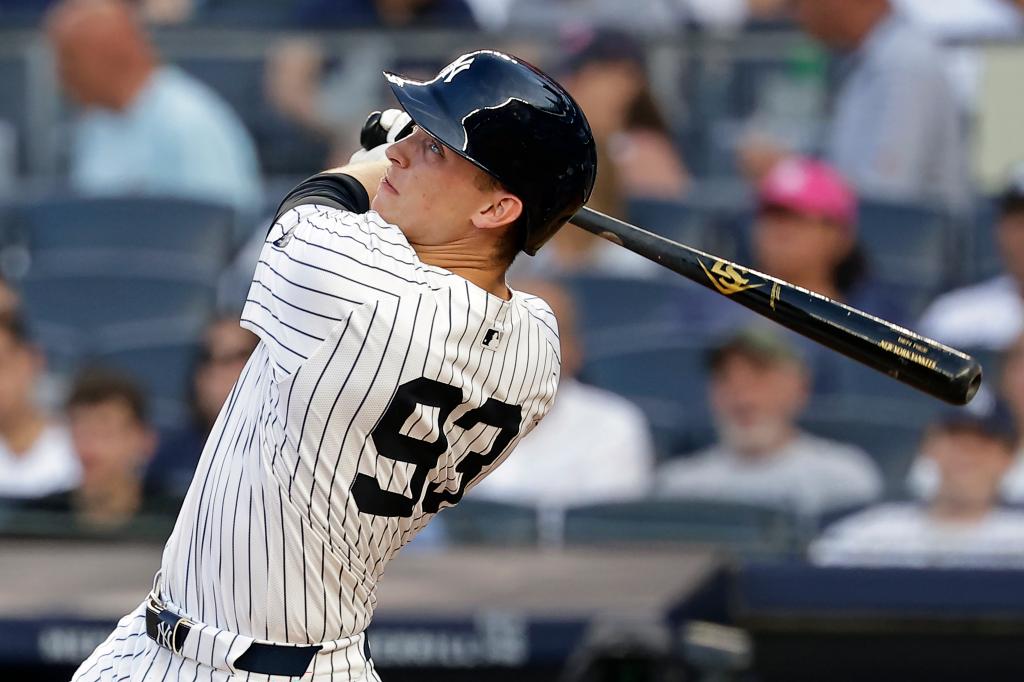 Ben Rice of the New York Yankees swinging a bat during his first MLB at bat at Yankee Stadium