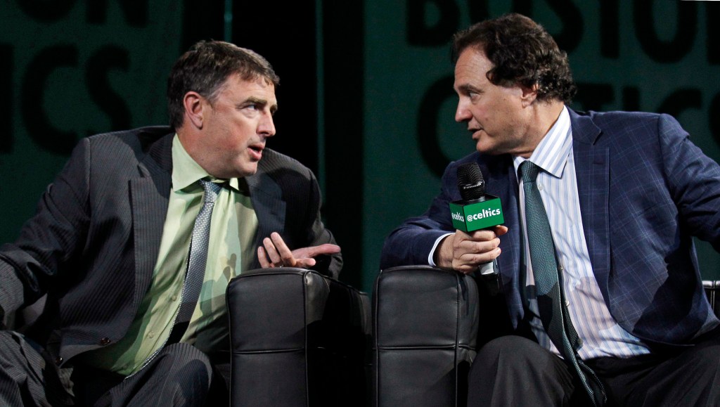Celtics co-owners Wyc Grousbeck, left, and Stephen Pagliuca talk before addressing season ticket holders during an NBA basketball draft party