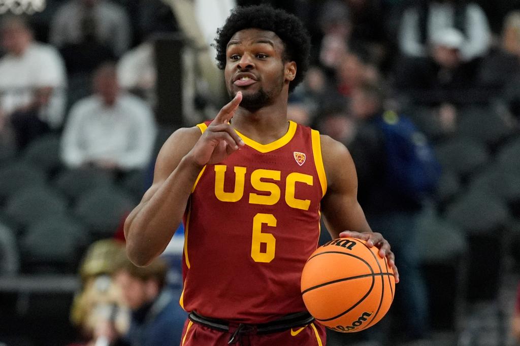 Southern California's Bronny James (6) brings the ball up the court during the first half of an NCAA college basketball game against Washington in the first round of the Pac-12 tournament Wednesday, March 13, 2024, in Las Vegas.