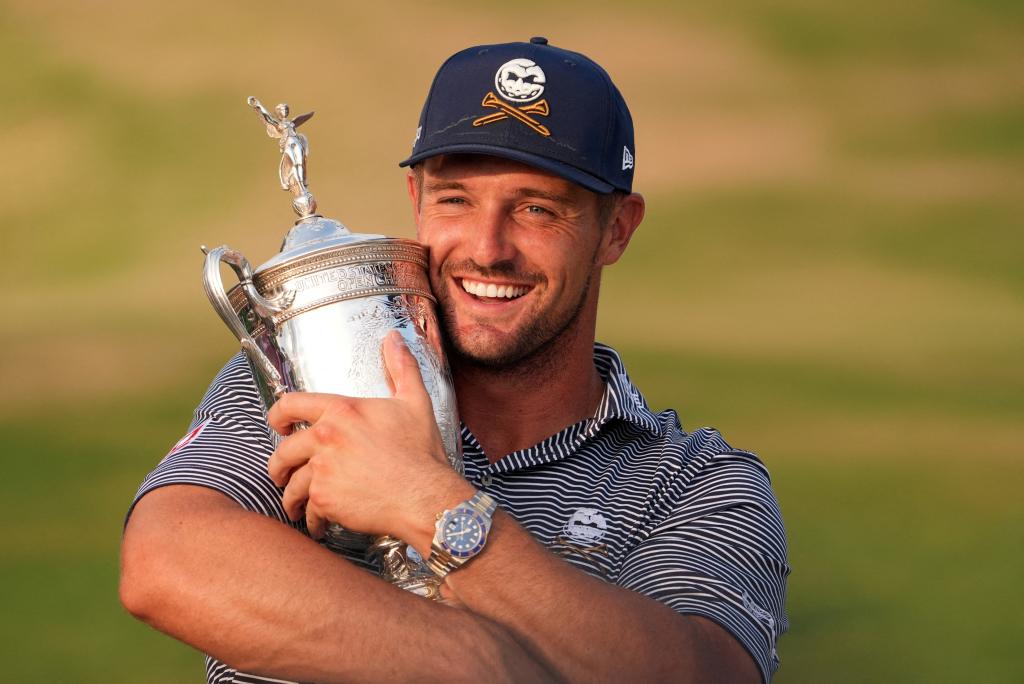 Bryson DeChambeau celebrates with the trophy after winning the U.S. Open golf tournament in North Carolina on June 16, 2024.