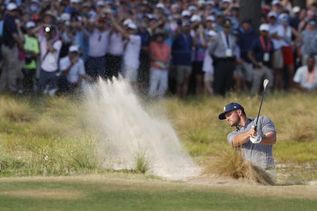 Bryson DeChambeau of hits out of the bunker to the 18th green during the final round of the 2024 US Open golf tournament at Pinehurst No. 2 course in Pinehurst, North Carolina on June 16, 2024.