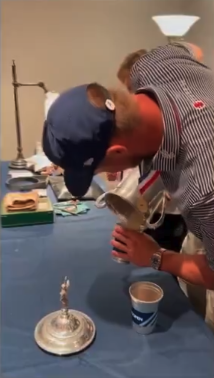 Bryson DeChambeau pours out the sand to prepare for wine out of the U.S. Open Championship. 