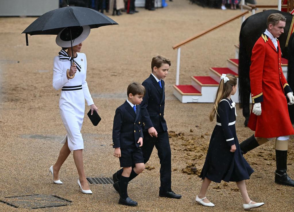 Prince George, who is second in line to the throne, appeared to reach almost to his mom's shoulders — no small feat given that she stands close to 6 feet tall in heels. 