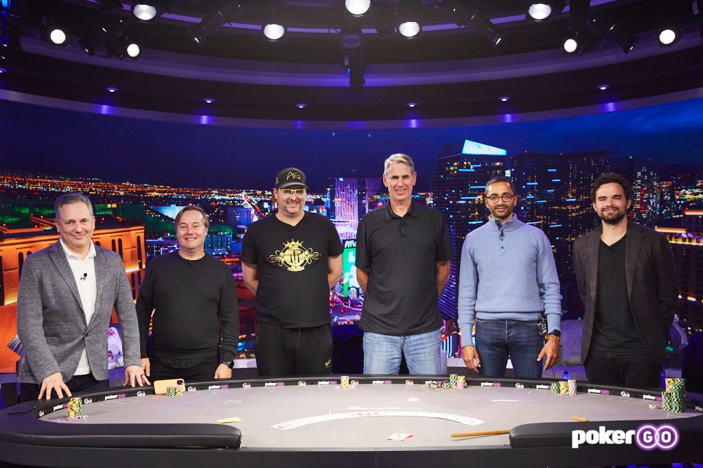 A group of men including David Sacks, Jason Calacanis, Phil Hellmuth, Bill Gurley, Chamath Palihapitiya, and Alan Keating standing in front of a poker table