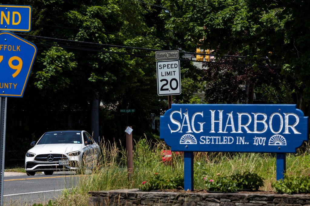 Cars drive along a local street on the day Pop singer Justin Timberlake was arrested and charged with driving while intoxicated in a neighborhood in the Hamptons according to authorities.