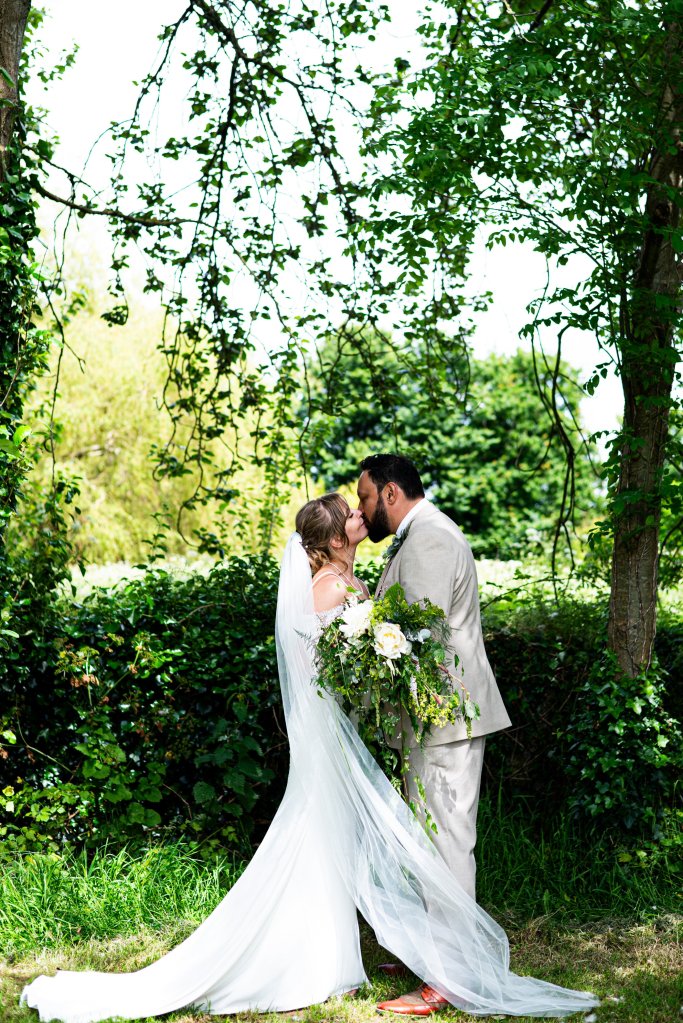 bride and groom kissing