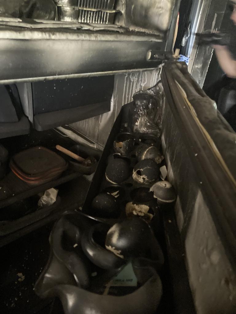 Charred eggs in a burnt out refrigerator at the Nir Oz kibbutz. 