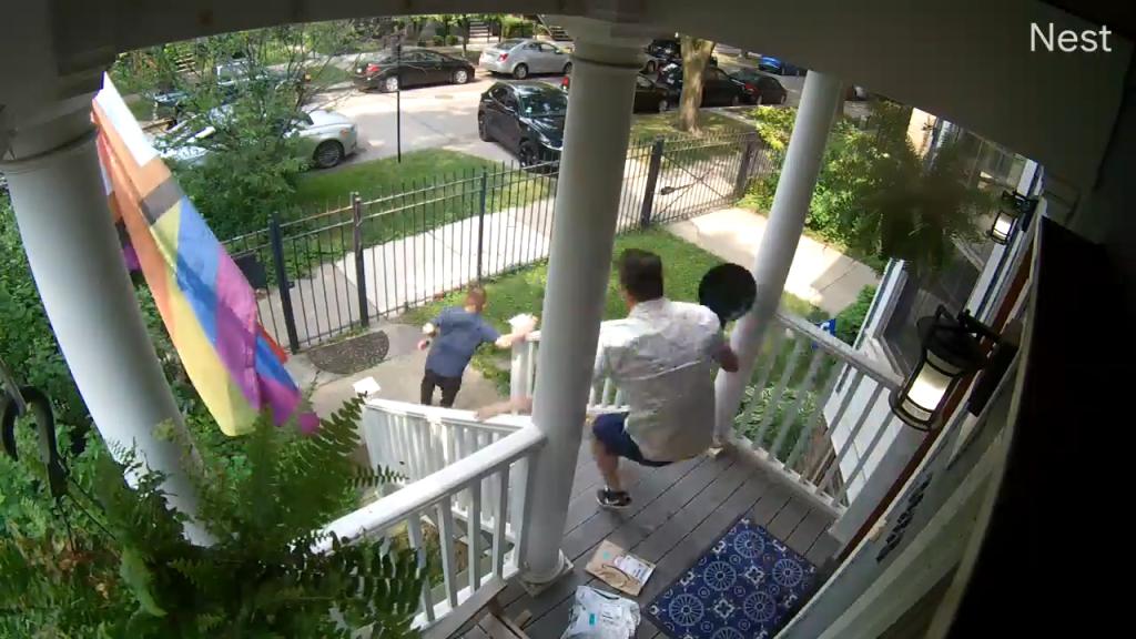 Security video captured Jason Williams chasing a home intruder out of his house with a frying pan on Thursday. 