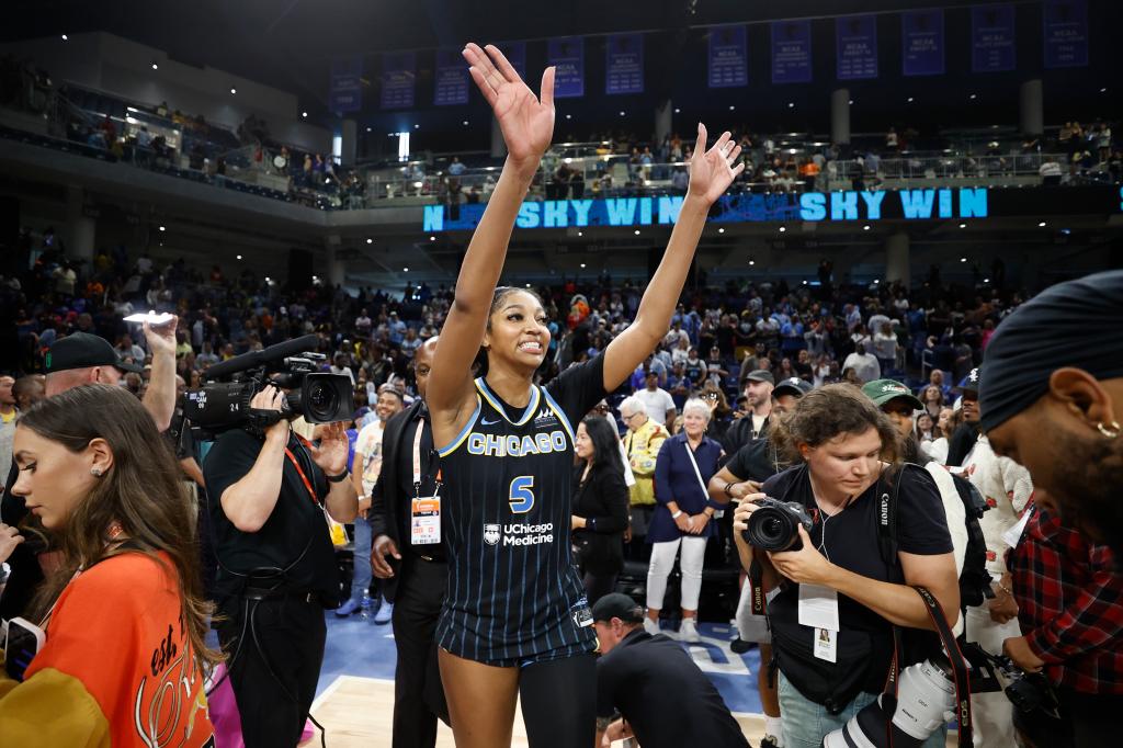 Chicago Sky forward Angel Reese celebrating a victory against Indiana Fever in basketball uniform at Wintrust Arena