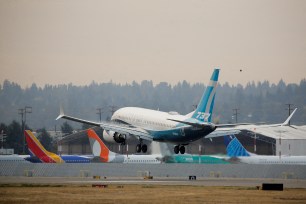 A Boeing 737 MAX 7 aircraft piloted by FAA Chief Steve Dickson landing during an evaluation flight at Boeing Field in Seattle, Washington