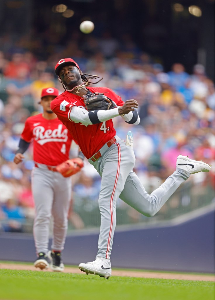 Reds shortstop Elly De La Cruz throws out the Brewers' Christian Yelich in the eighth inning on Saturday.