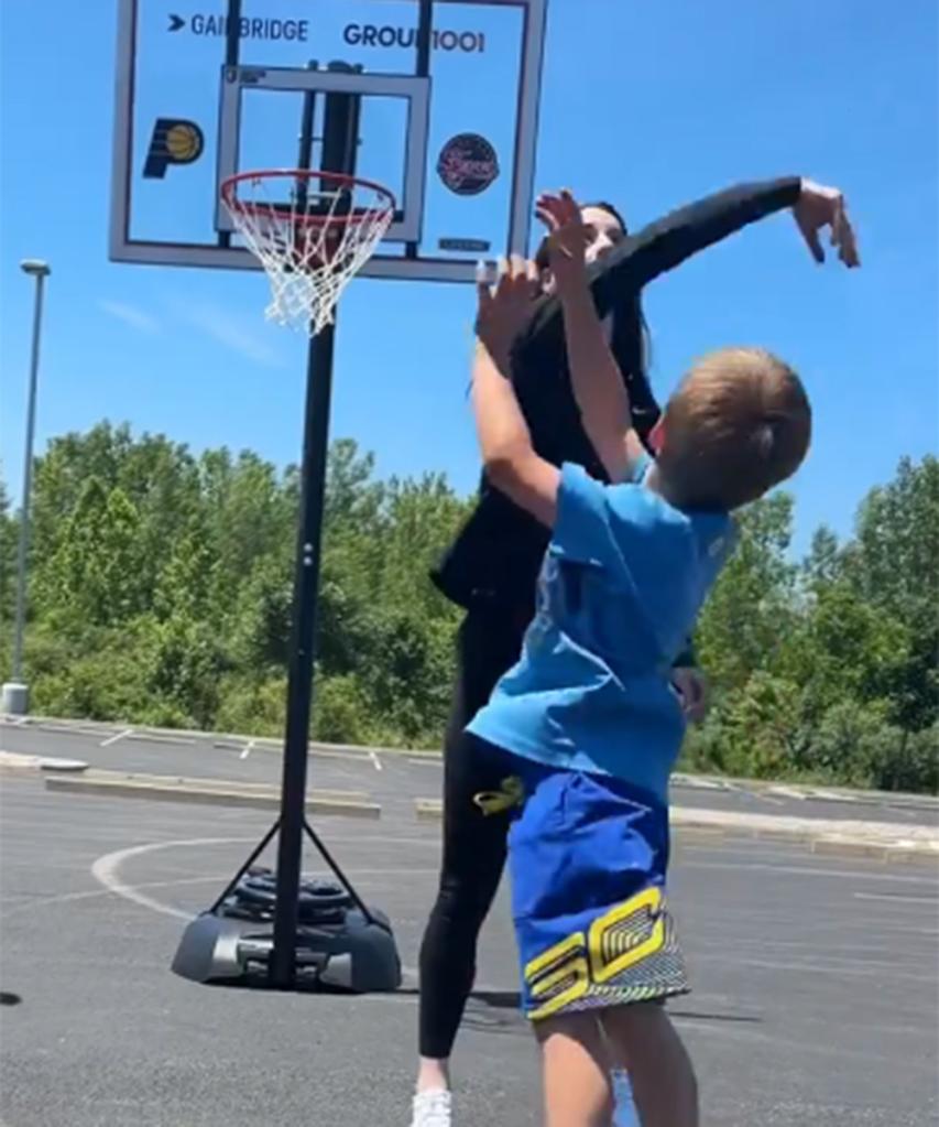 Caitlin Clark playing 1-1 with a young fan at a community event in Indiana on June 11, 2024.  