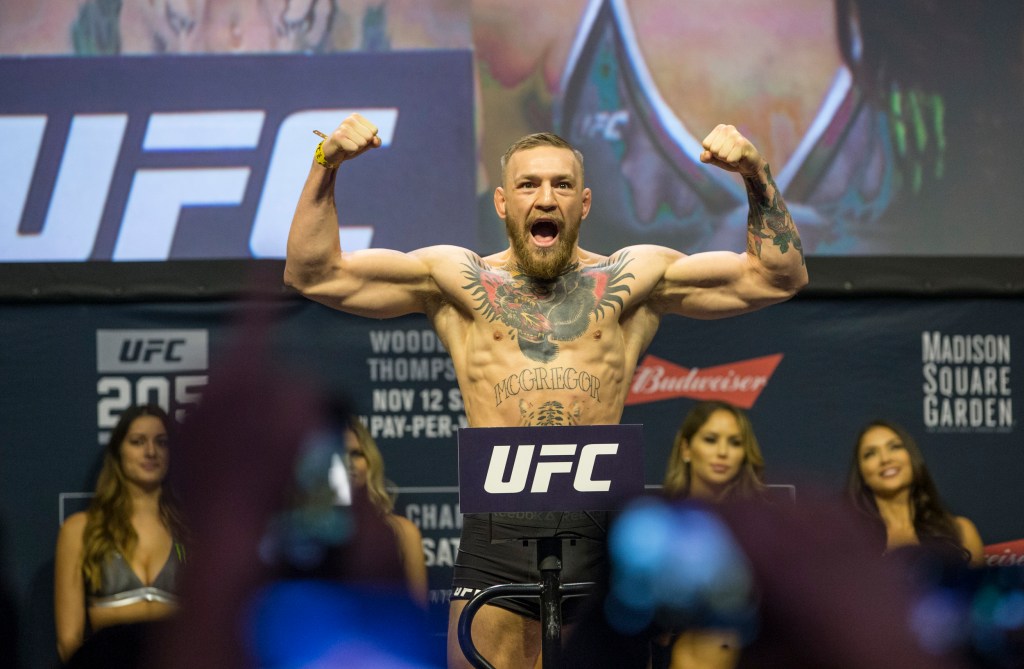 Conor McGregor weighs in as he gets ready to fight Eddie Alvarez as they headline UFC 205