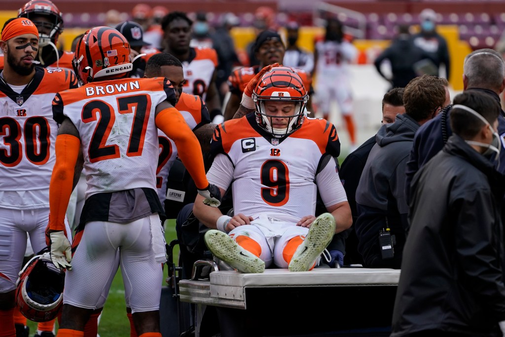 Joe Burrow being carted off the field in 2020.