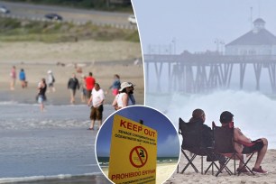 people at the beach with keep out sign