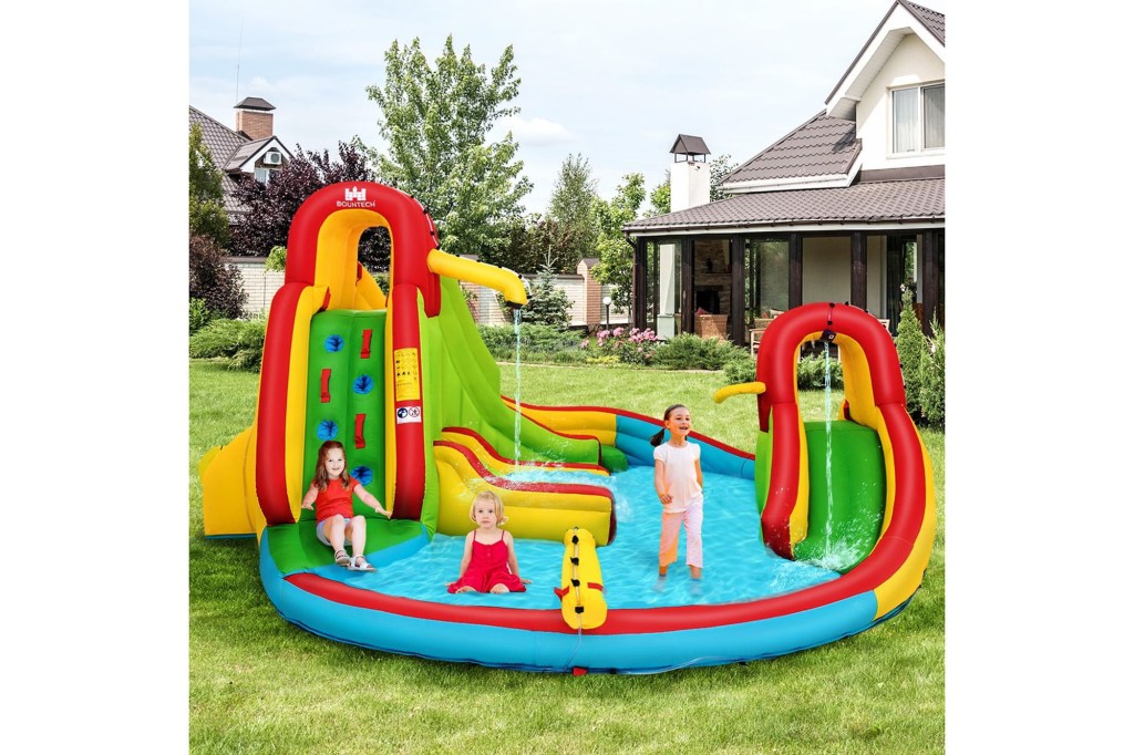 A group of kids playing in a water park