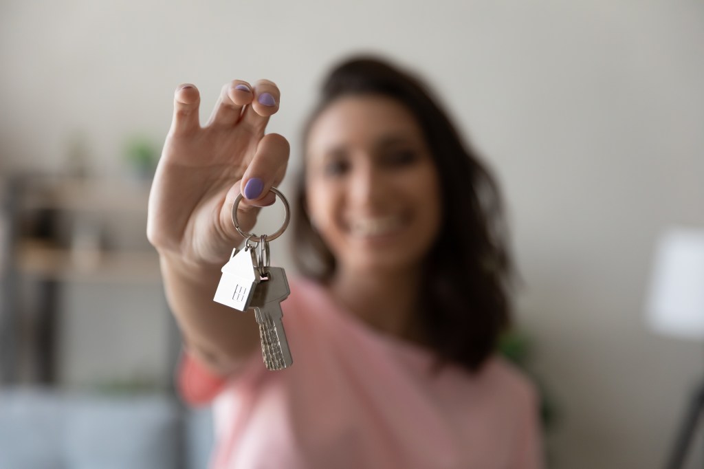 woman holding house keys