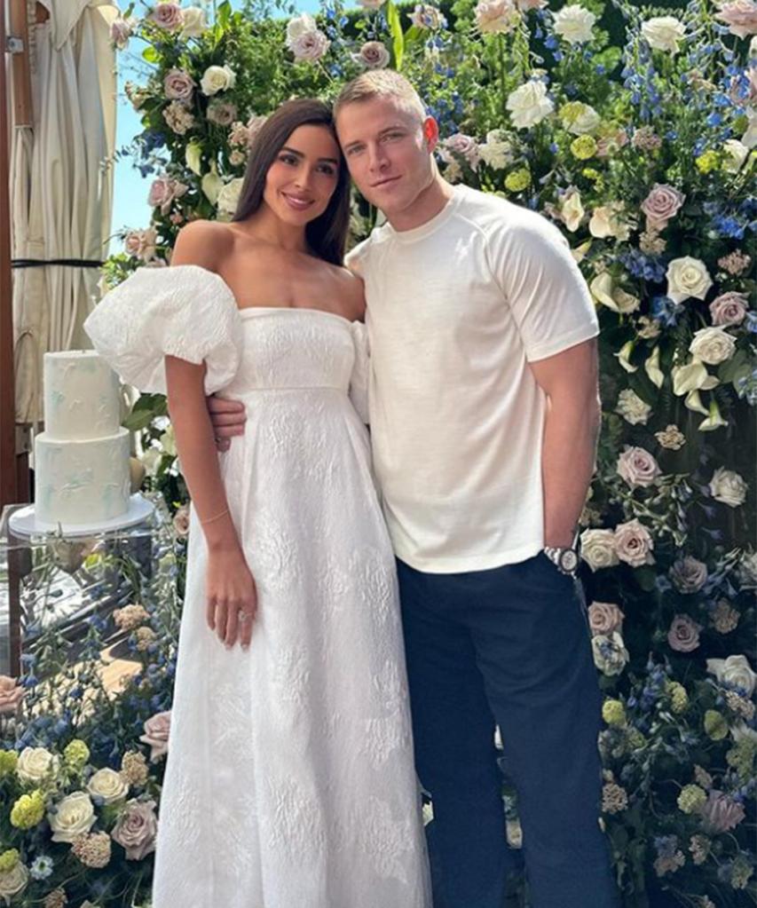 Olivia Culpo and Christian McCaffrey at her bridal shower in Malibu in May 2024. 