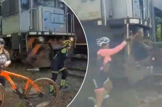 Cyclist taking selfie hit by oncoming freight train