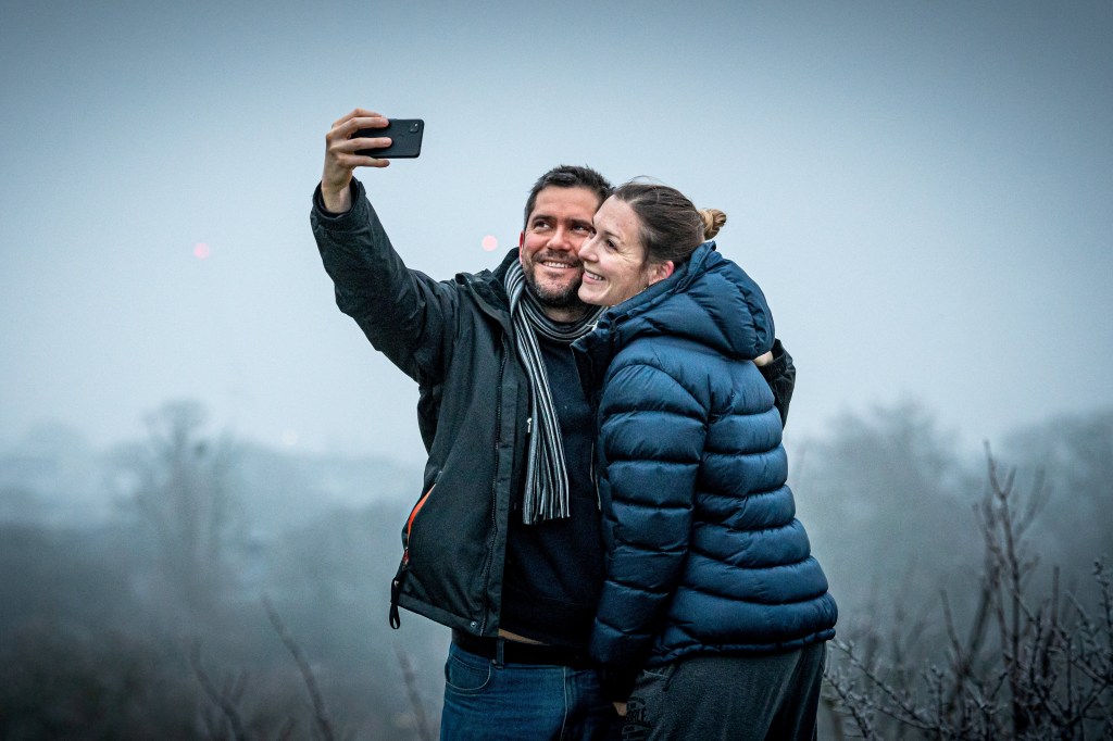 A man and woman taking a selfie together