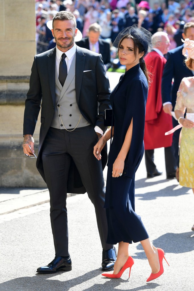 David Beckham and Victoria Beckham in formal attire arriving at St George's Chapel at Windsor Castle for Prince Harry and Meghan Markle's wedding