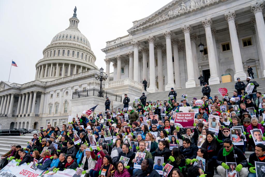 Demonstrators sit on the Senate steps before they are arrested outside of the U.S. Capitol during an immigration rally in support of the Deferred Action for Childhood Arrivals (DACA)