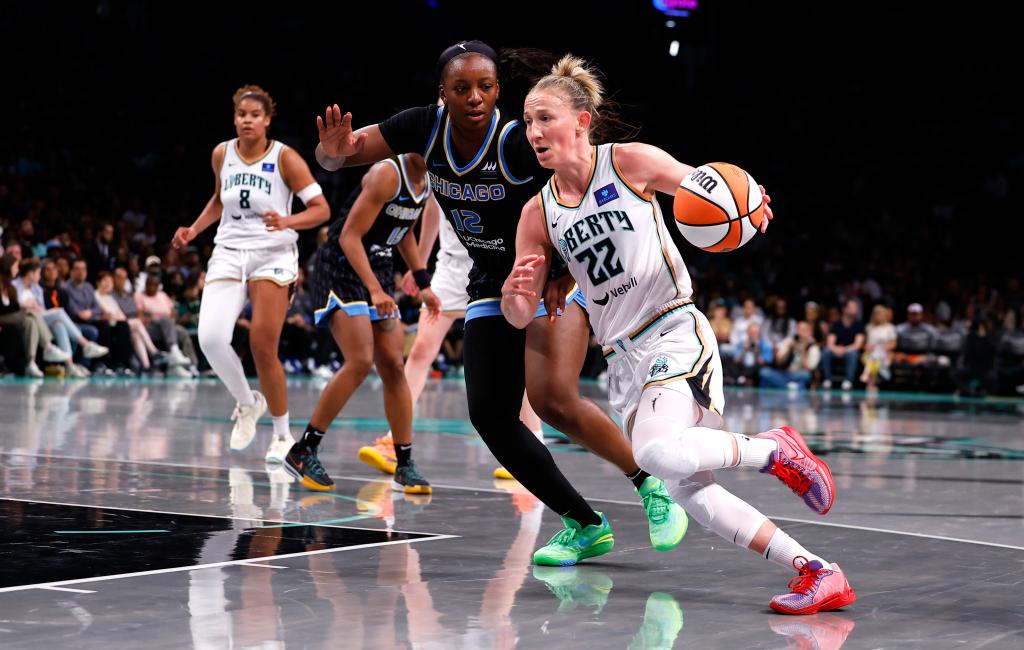 Liberty guard Courtney Vandersloot (22) drives to the basket against Chicago Sky forward Michaela Onyenwere (12) during the second half at the Barclays Center.
